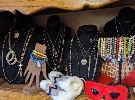 Display of handcrafted beaded necklaces, bracelets, and decor from local mountain artisans